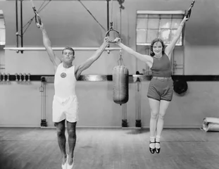  Athletes on rings in gym  © everettovrk