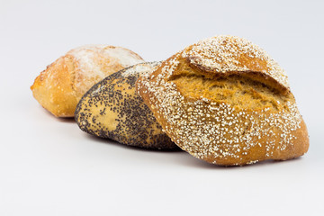 Composition with bread and rolls isolated on white