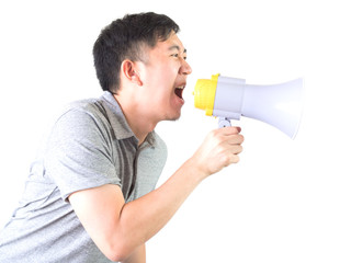 Young Asian man shouting with a megaphone isolated white background