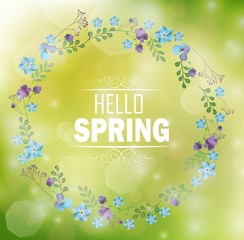 Circle floral frame with text hello spring and bokeh background