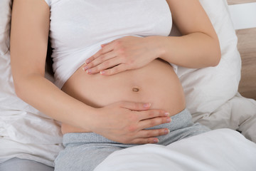 Pregnant Woman Hand On Belly
