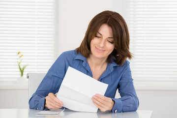Happy Woman Reading Letter