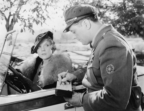 Woman Getting A Ticket From A Policeman 