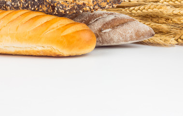 Composition with bread and rolls isolated on white