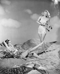 Poster Two women relax at the beach  © everettovrk
