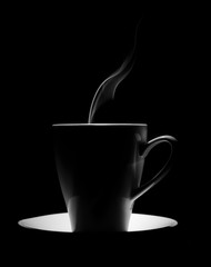 coffee cup on a black background with steam