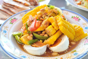 Thai food - Dish of spicy salad with corn and egg