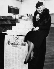 Portrait of woman eating birthday cake 