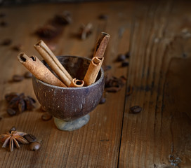 coffee beans, star anise, cinnamon on wooden background
