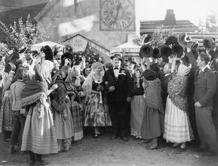 Bride and groom walking through a wedding party 