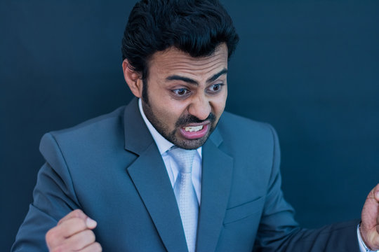 Angry businessman on isolated background
