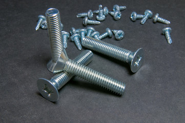 Bolts and Screws on grey. Left upright bolt (front light)