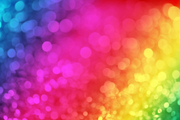 Colorful ray bokeh glitter defocused lights abstract background.