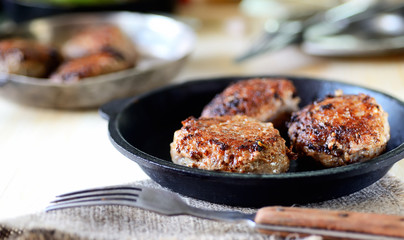 homemade meatballs in a pan, tomato, basil