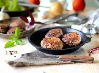 homemade meatballs in a pan, tomato, basil