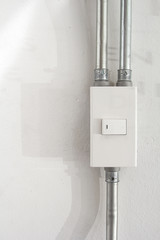 White light switch and faceplate on white background