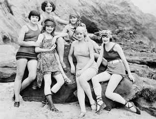 Six women posing at the beach 