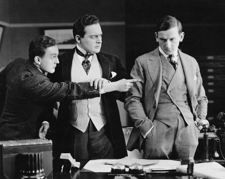 Businessman accusing colleague 