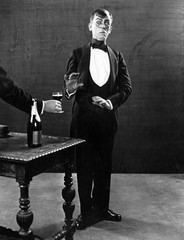 Man recoiling from beverage 