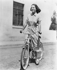 Young woman riding her bike 