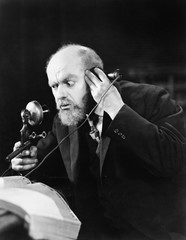Man talking on the telephone looking intense 