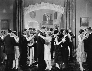 Group of people dancing in a ballroom 