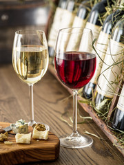Glasses of wine and cheese plate.
