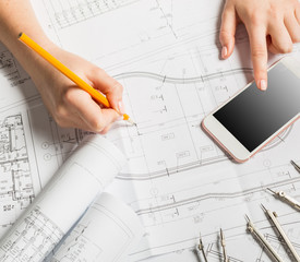 Architect working on blueprint