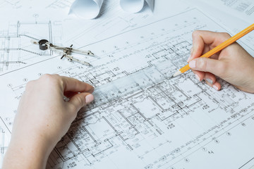Architect working on blueprint