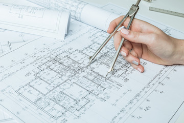 Architect working on blueprint