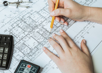 Architect working on blueprint