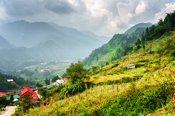 Naklejka na ściany i meble Scenic view of village houses and the Hoang Lien Mountains