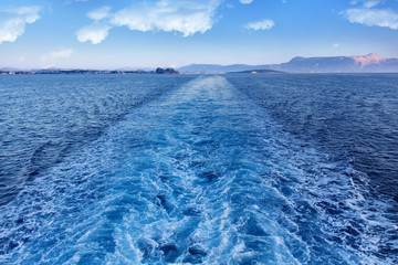 Ferry leaving Corfu island - leaving a trail