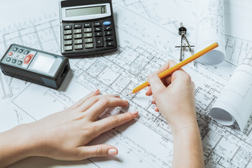 Architect working on blueprint