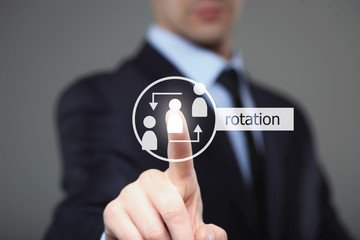 business, technology and internet concept - businessman pressing Rotation button on virtual screens