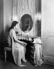 Obraz na płótnie Canvas Woman sitting at her vanity table 