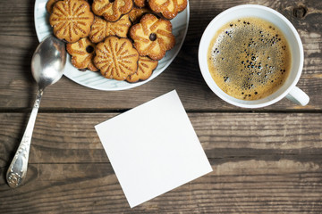 Morning coffee with cookies on a wooden table
