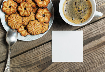 Morning coffee with cookies on a wooden table