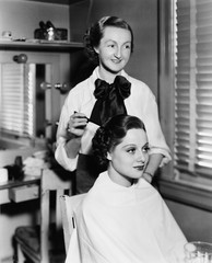 Young woman getting her hair done in a hair salon 