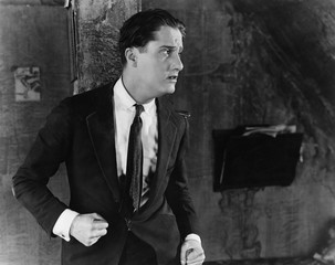 Scared angry man with balled fists 