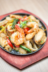Sizzling seafood with Thai herbs.