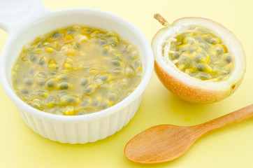 Maracuja, passion-fruit juice in white bowl.