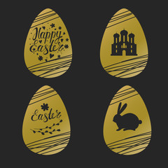 Set of Easter golden eggs with rabbit, inscription and church
