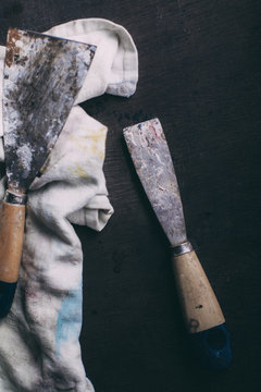 Closeup of two trowels stained