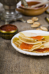 Pancakes with caviar on the table