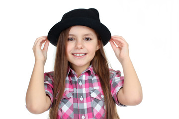 sweet and beautiful little girl in black hat isolated on white background