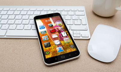 Workplace with modern mobile phone