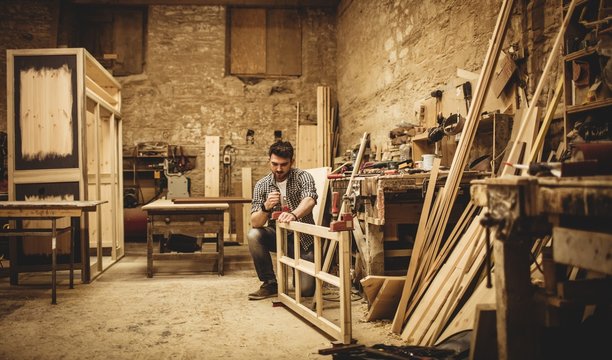 Carpenter working on his craft - Powered by Adobe