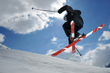 Naklejka na ściany i meble Ski jumper with crossed skis
