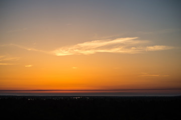 sunset over the forest in fog